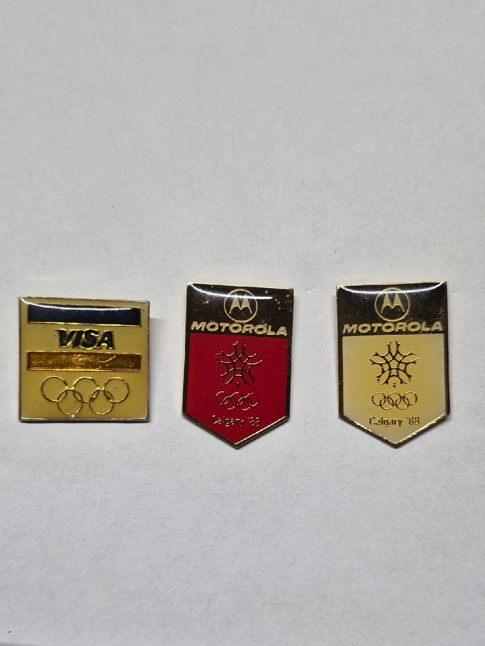 Motorola & VISA '88 Olympic Pin Trio in Gold, Red, Cream